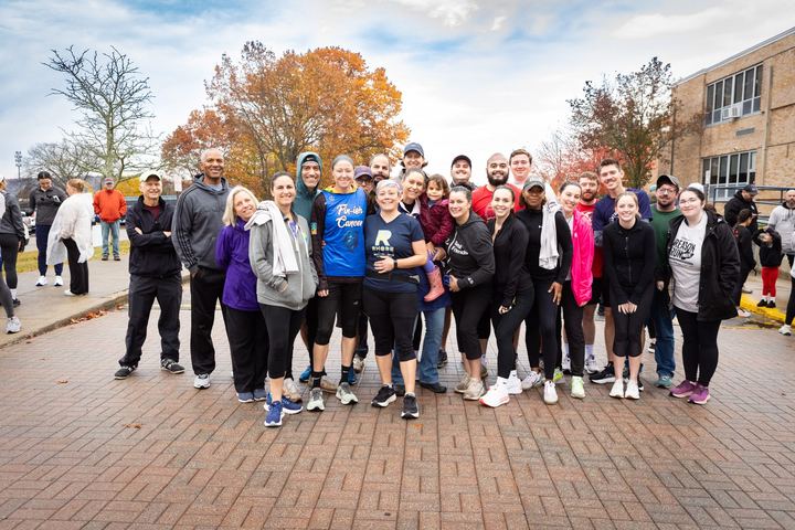 A large group of participants posed together