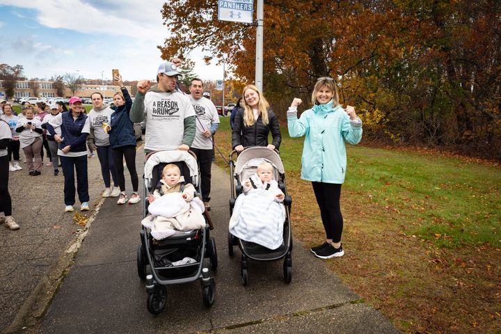 Moms walking together with strollers